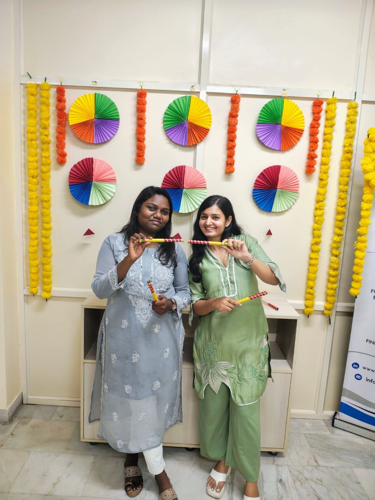 Employees smiling during a festive celebration at the office