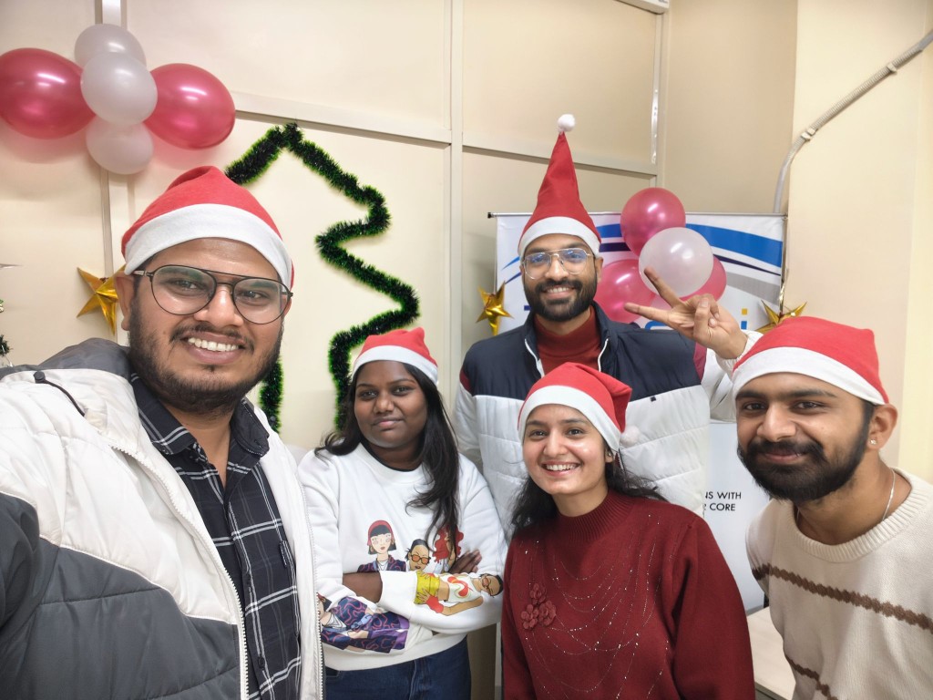 Employees taking a selfie during a holiday celebration