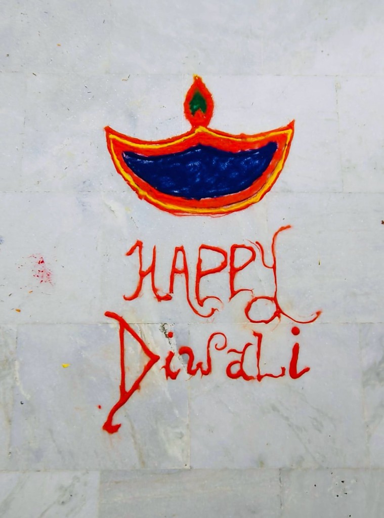 Handmade Diwali rangoli on the office floor celebrating the festival